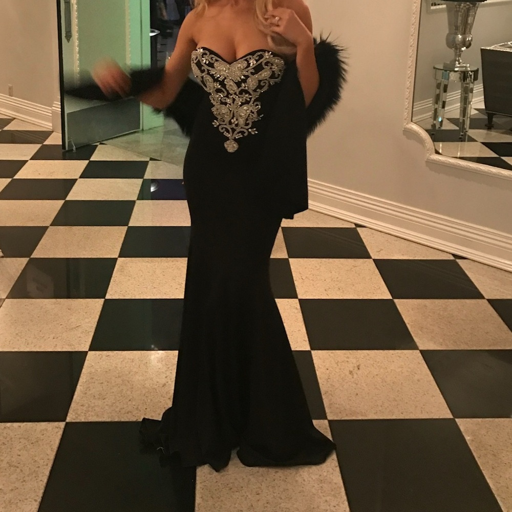 Black Jovani strapless gown with sweetheart neck and beaded train with hooks